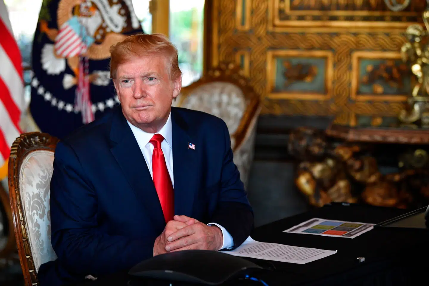 US President Donald Trump answers questions from reporters after making a video call to the troops stationed worldwide at the Mar-a-Lago estate in Palm Beach Florida, on December 24, 2019. Nicholas Kamm / AFP