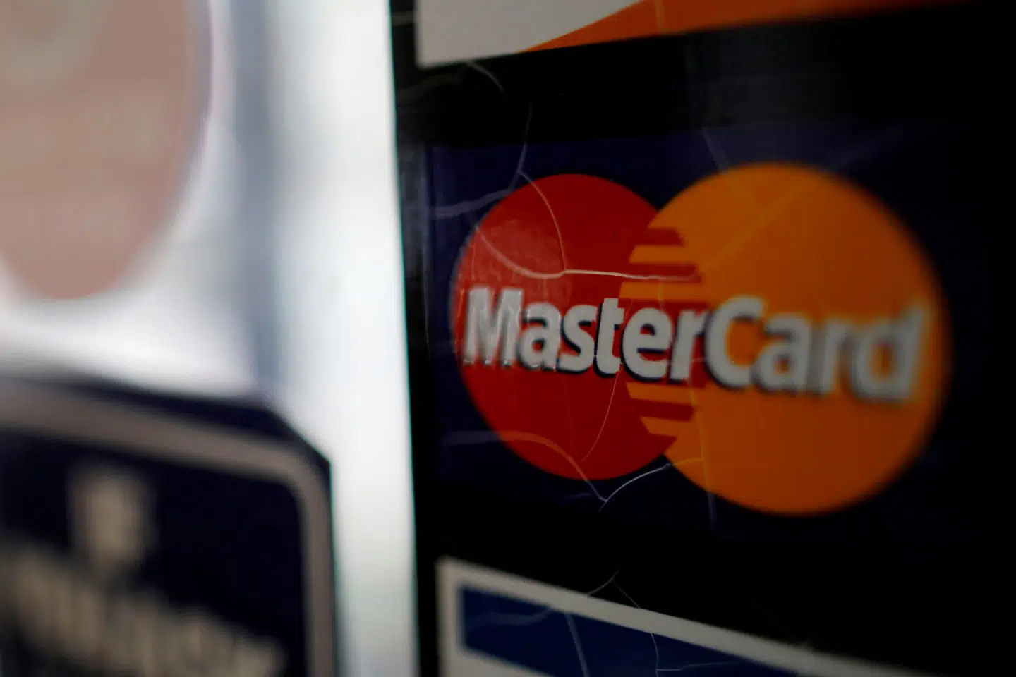 FILE PHOTO: A sticker shows that a store accepts MasterCard in Harvard Square in Cambridge, Massachusetts, U.S., July 25, 2018. REUTERS/Brian Snyder/File Photo