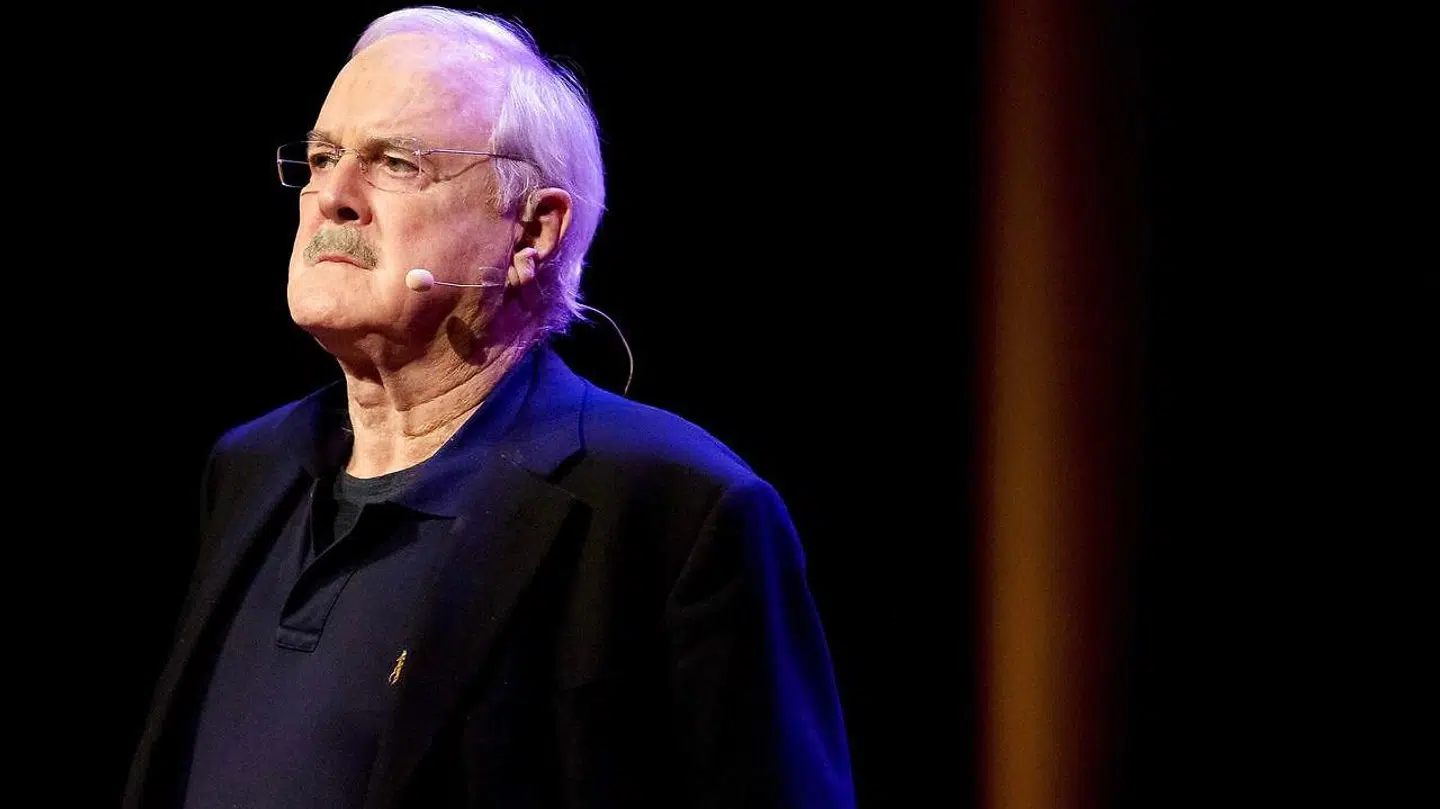 John Cleese performs.
