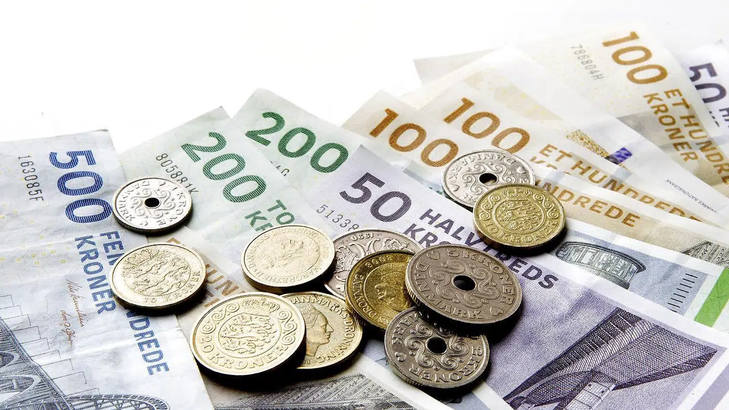 (ARKIV) Pengesedler og mønter, den 10. december 2013.