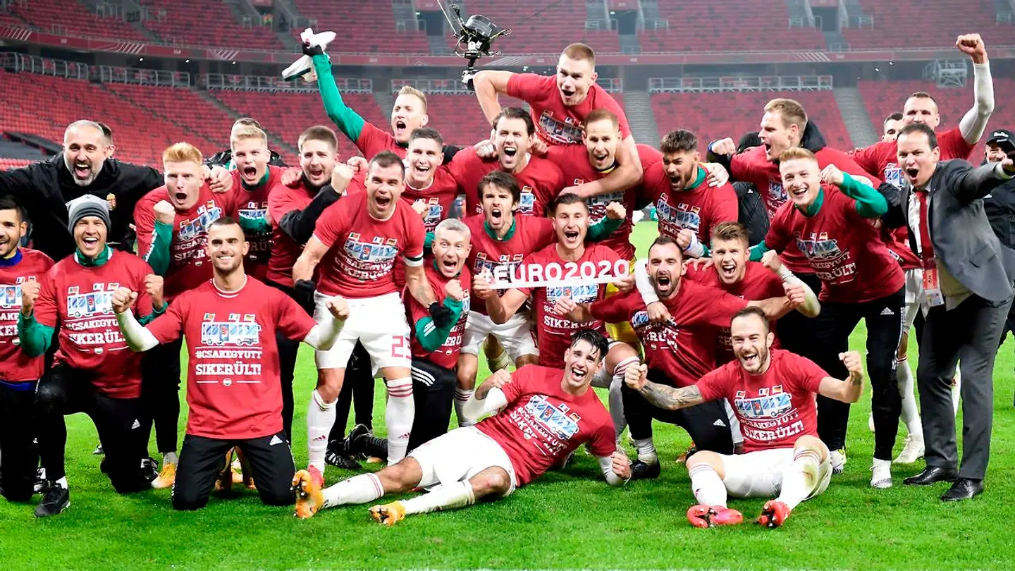 Hungary's players celebrate after Hungary won the match 2-1 and qualified for the Euro 2020 during the UEFA European Qualifiers play-off final football match between Hungary and Iceland at the Puskas Arena in Budapest on November 12, 2020. (Photo by Attila KISBENEDEK / AFP)