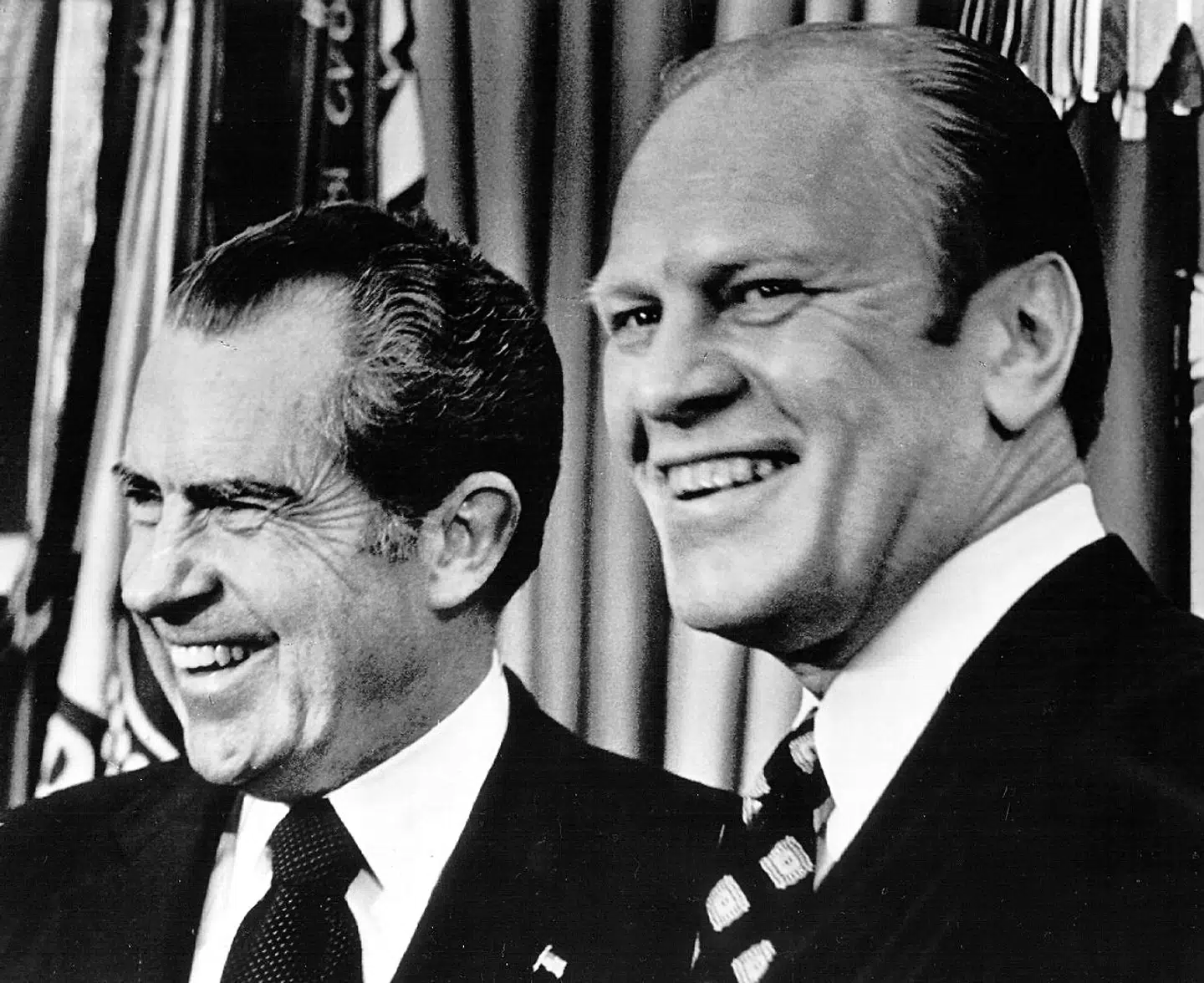 (FILES) Vice President-designate Gerald Ford (R) laughs with President Richard Nixon at the White House in Washington, DC 06 December, 1973 after the vote of approval of his nomination by Congress. January 9, 2013 marks Nixon's 100th birthday. AFP PHOTO/HO/NATIONAL ARCHIVES/GETTY OUT == FOR NEWSPAPERS, INTERNET, TELCOS & TELEVISION USE ONLY ==