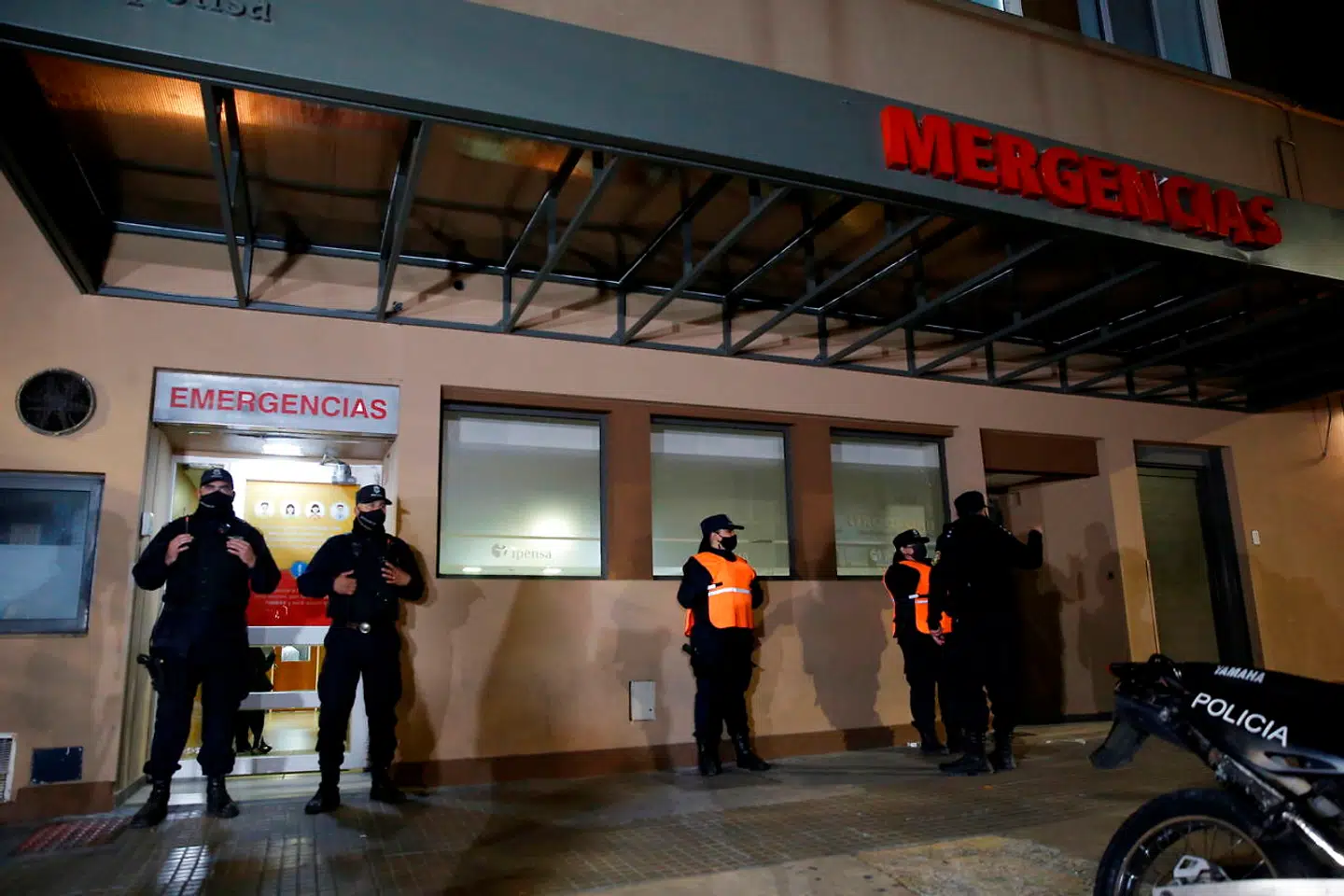 epa08794319 Guards monitor an emergency entrance to the Ipensa clinic where former Argentine soccer player Diego Maradona was admitted, in La Plata, Buenos Aires, Argentina, 02 November 2020. Diego Maradona was admitted at the Ipensa sanatorium to undergo a 'general check-up' after a 'mood drop', according to Doctor Leopoldo Luque. EPA/Demian Alday Estevez