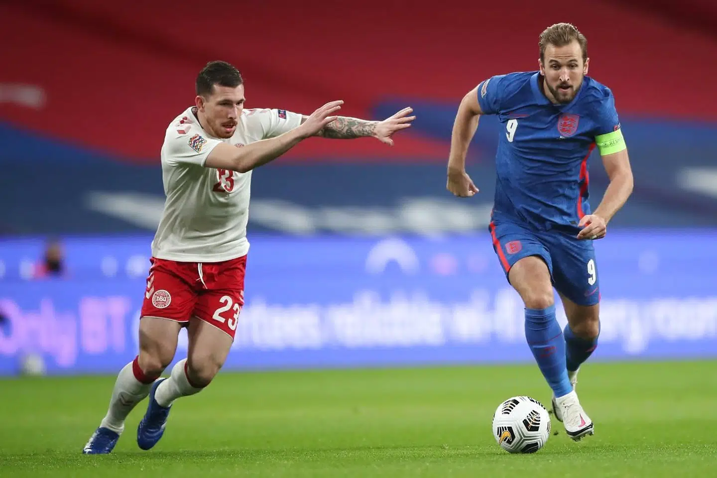 England's striker Harry Kane (R) takes on Denmark's midfielder Pierre-Emile Hojbjerg (L) during the UEFA Nations League group A2 football match between England and Denmark at Wembley stadium in north London on October 14, 2020. (Photo by Nick Potts / POOL / AFP) / NOT FOR MARKETING OR ADVERTISING USE / RESTRICTED TO EDITORIAL USE