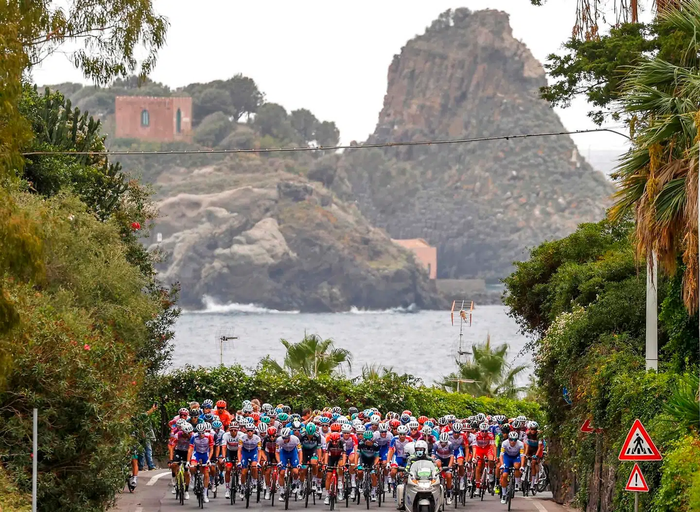 The pack rides during the 4th stage of the Giro d'Italia 2020 cycling race, a 140-kilometer route between Catania and Villafranca Tirrena, Sicily, on October 6, 2020. (Photo by Luca Bettini / AFP)