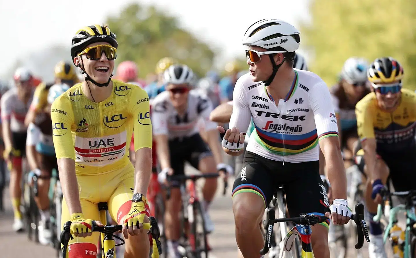 Team UAE Emirates rider Slovenia's Tadej Pogacar wearing the overall leader's yellow jersey rides with Team Trek rider Denmark's Mads Pedersen during the 21st and last stage of the 107th edition of the Tour de France cycling race, 122 km between Mantes-la-Jolie and Champs Elysees Paris, on September 20, 2020. (Photo by KENZO TRIBOUILLARD / AFP)