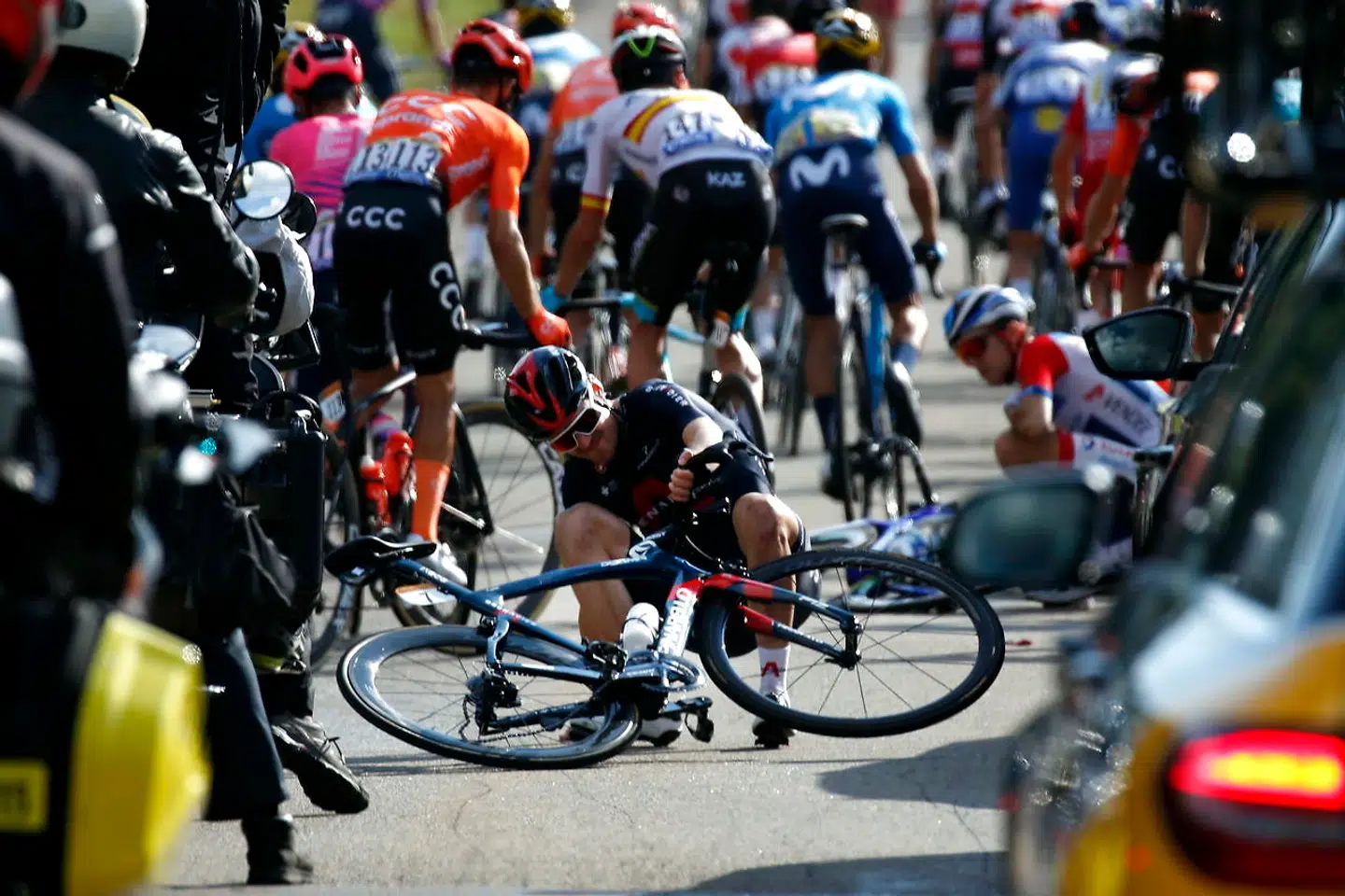 epa08678958 Russian rider Pavel Sivakov (C) of the Ineos Grenadiers team reacts after crashing during during the 19th stage of the 107th edition of the Tour de France cycling race over 166.5km from Bourg-en-Bresse to Champagnole, France, 18 September 2020. EPA/SEBASTIEN NOGIER