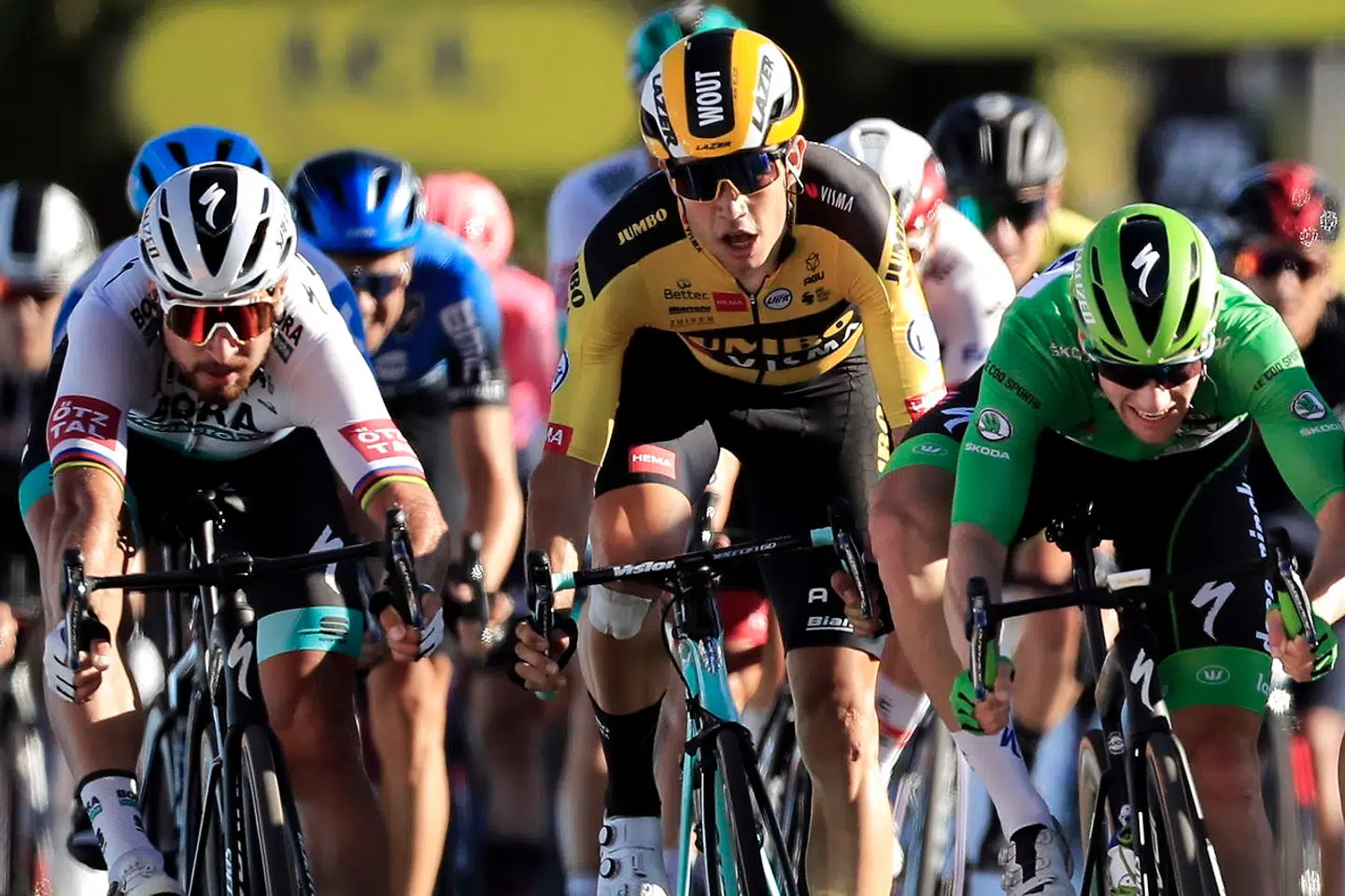epa08657274 Slovakian rider Peter Sagan (L) of the Bora-Hansgrohe team, Belgian rider Wout Van Aert (C) of Team Jumbo-Visma, and Irish rider Sam Bennett (R) of the Deceuninck Quick-Step cross the finish line during the 11th stage of the 107th edition of the Tour de France cycling race over 167.5km from Chatelaillon-Plage to Poitiers, France, 09 September 2020. EPA/Christophe Petit-Tesson / Pool