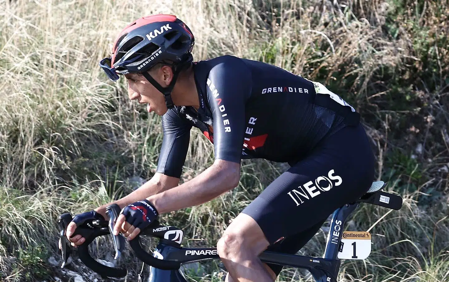 Team Ineos rider Colombia's Egan Bernal (R) climbs the Grand Colombier pass behind the leader's group during the 15th stage of the 107th edition of the Tour de France cycling race, 175 km between Lyon and Grand Colombier, on September 13, 2020. (Photo by KENZO TRIBOUILLARD / AFP)