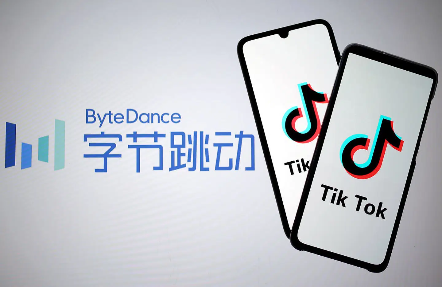 FILE PHOTO: Tik Tok logos are seen on smartphones in front of a displayed ByteDance logo in this illustration taken November 27, 2019. REUTERS/Dado Ruvic/Illustration - RC2OJD9AMEJB/File Photo