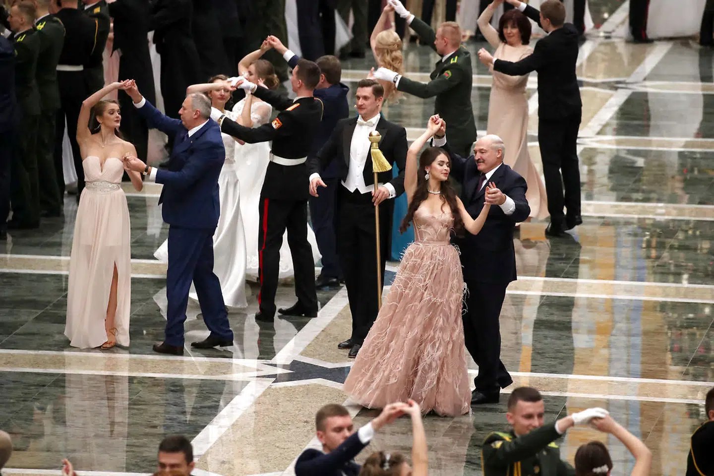 Mens landets førstedame lever ydmygt og alkoholiseret i parrets fødeby, fører Lukasjenko sig frem på dansegulvet med sin seneste erobring, den 22-årige tidligere Miss Hviderusland, Maria Vasilevich.