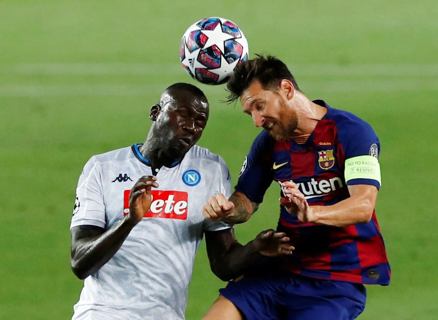 Soccer Football - Champions League - Round of 16 Second Leg - FC Barcelona v Napoli - Camp Nou, Barcelona, Spain - August 8, 2020 Barcelona's Lionel Messi in action with Napoli's Kalidou Koulibaly, as play resumes behind closed doors following the outbreak of the coronavirus disease (COVID-19) REUTERS/Albert Gea