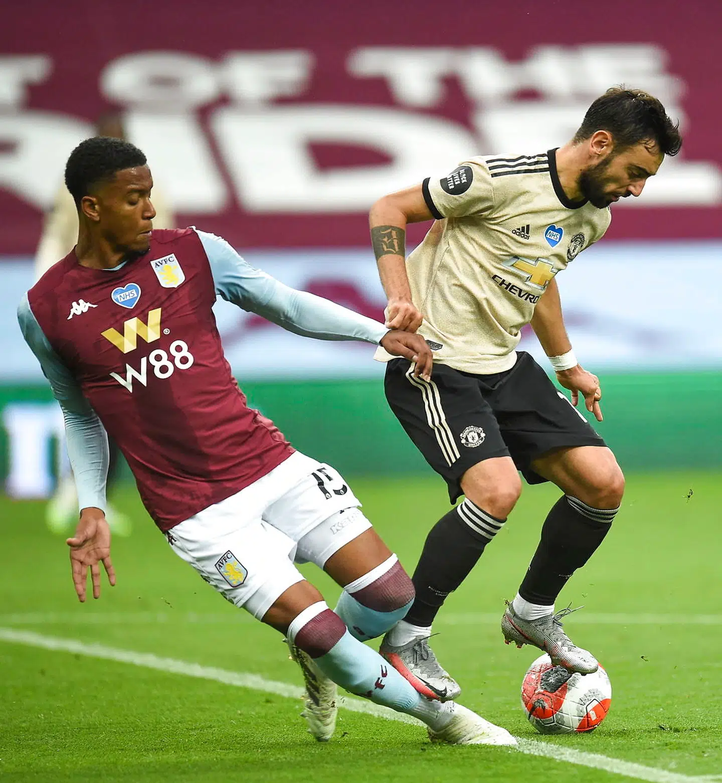 epa08537564 Ezri Konsa (L) of Aston Villa in action against Bruno Fernandes (R) of Manchester United during the English Premier League match between Aston Villa and Manchester United in Birmingham, Britain, 09 July 2020. EPA/Oli Scarff/NMC/Pool EDITORIAL USE ONLY.No use with unauthorized audio, video, data, fixture lists, club/league logos or 'live' services. Online in-match use limited to 120 images, no video emulation.No use in betting, games or single club/league/player publications.