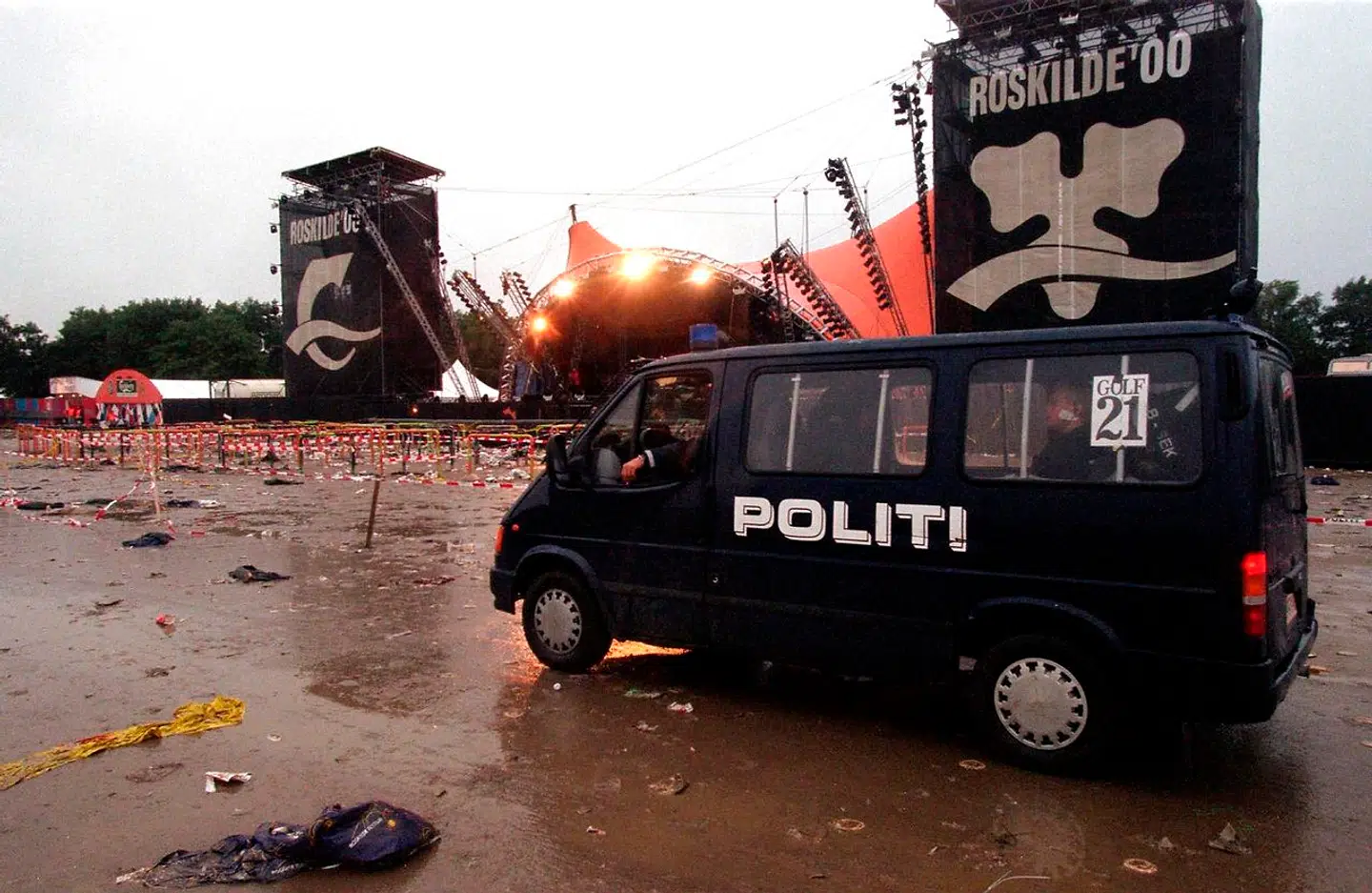 A police van patrols the grounds of the Roskilde music festival Saturday 01 July 2000 following a fatal incident here. The festival in western Denmark was hit late 30 June by the first tragedy in its 30-year history when eight people were crushed and trampled to death in a crowd surge as American group Pearl Jam were playing on the main stage. Eight people were crushed and trampled to death, including at least one foreign national. JENS NOERGAARD LARSEN / SCANPIX DENMARK / AFP
