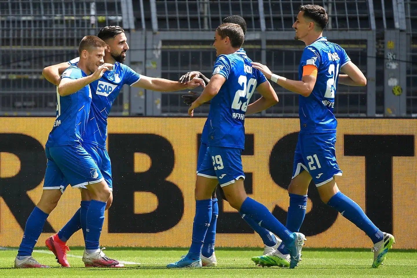 Soccer Football - Bundesliga - Borussia Dortmund v TSG 1899 Hoffenheim - Signal Iduna Park, Dortmund, Germany - June 27, 2020 Hoffenheim's Andrej Kramaric celebrates scoring their first goal with teammates, following the resumption of play behind closed doors after the outbreak of the coronavirus disease (COVID-19) Ina Fassbender/Pool via REUTERS DFL regulations prohibit any use of photographs as image sequences and/or quasi-video