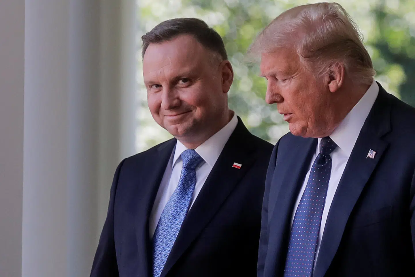 Polens præsident, Andrzej Duda (til venstre), er den første udenlandske statsleder til at besøge Det Hvide Hus, efter at coronakrisen brød ud. Carlos Barria/Reuters