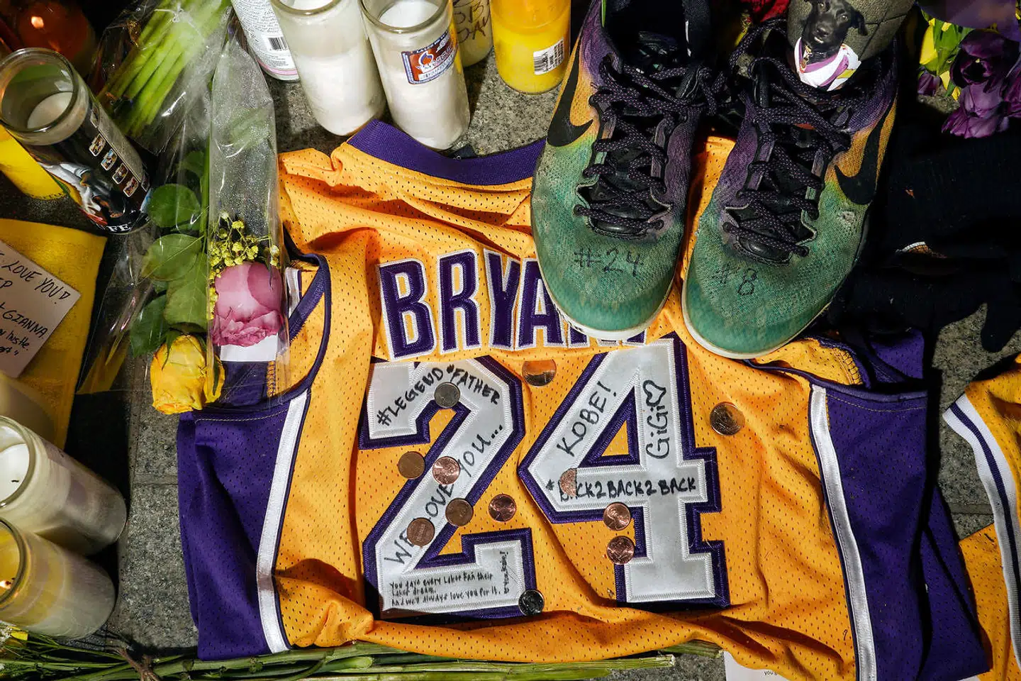 FILE PHOTO: Memorabilia and candles sit in Microsoft Square near the Staples Center to pay respects to Kobe Bryant after a helicopter crash killed the retired basketball star, in Los Angeles, California, U.S., January 28, 2020. REUTERS/Kyle Grillot/File Photo