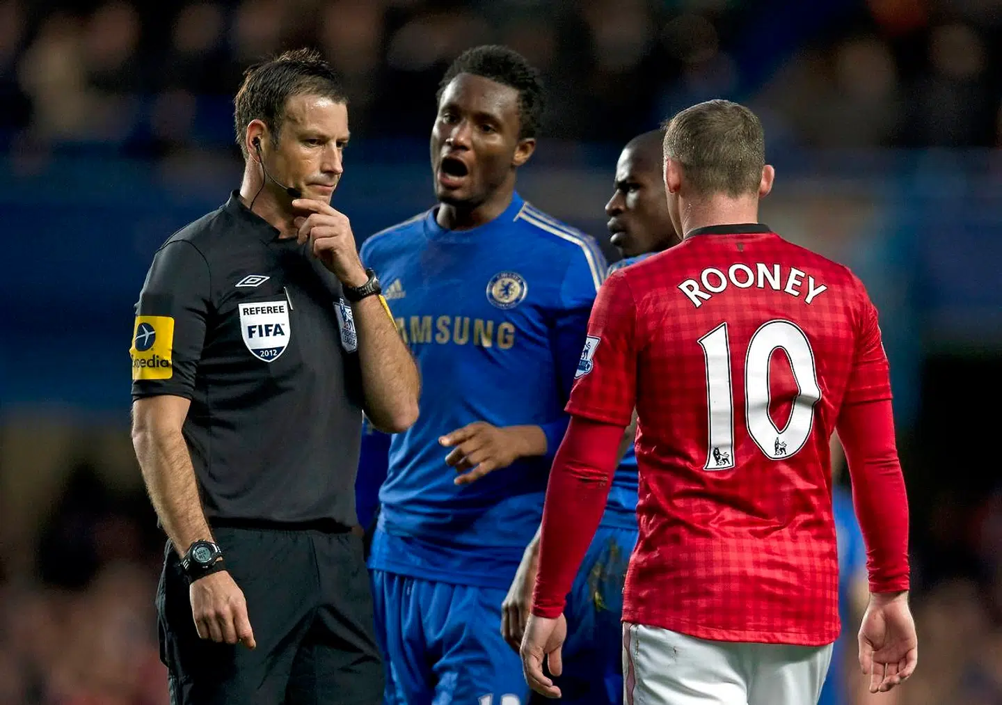 A file picture taken on October 28, 2012 shows Chelsea's Nigerian midfielder John Mikel Obi (2nd L) talking with referee Mark Clattenburg (L) during the English Premier League football match between Chelsea and Manchester United at Stamford Bridge in London. London's Metropolitan Police have confirmed that they have received a complaint about allegedly racist comments made by a top flight referee during last weekend's match between Chelsea and Manchester United. Clattenburg is alleged to have used "inappropriate language", reportedly of a racist nature, towards Chelsea's Nigerian and Spanish players John Mikel Obi and Juan Mata at Stamford Bridge on October 28, 2012. AFP PHOTO/ADRIAN DENNIS RESTRICTED TO EDITORIAL USE.No use with unauthorized audio, video, data, fixture lists, club/league logos or "live" services. Online in-match use limited to 45 images, no video emulation.No use in betting, games or single club/league/player publications.