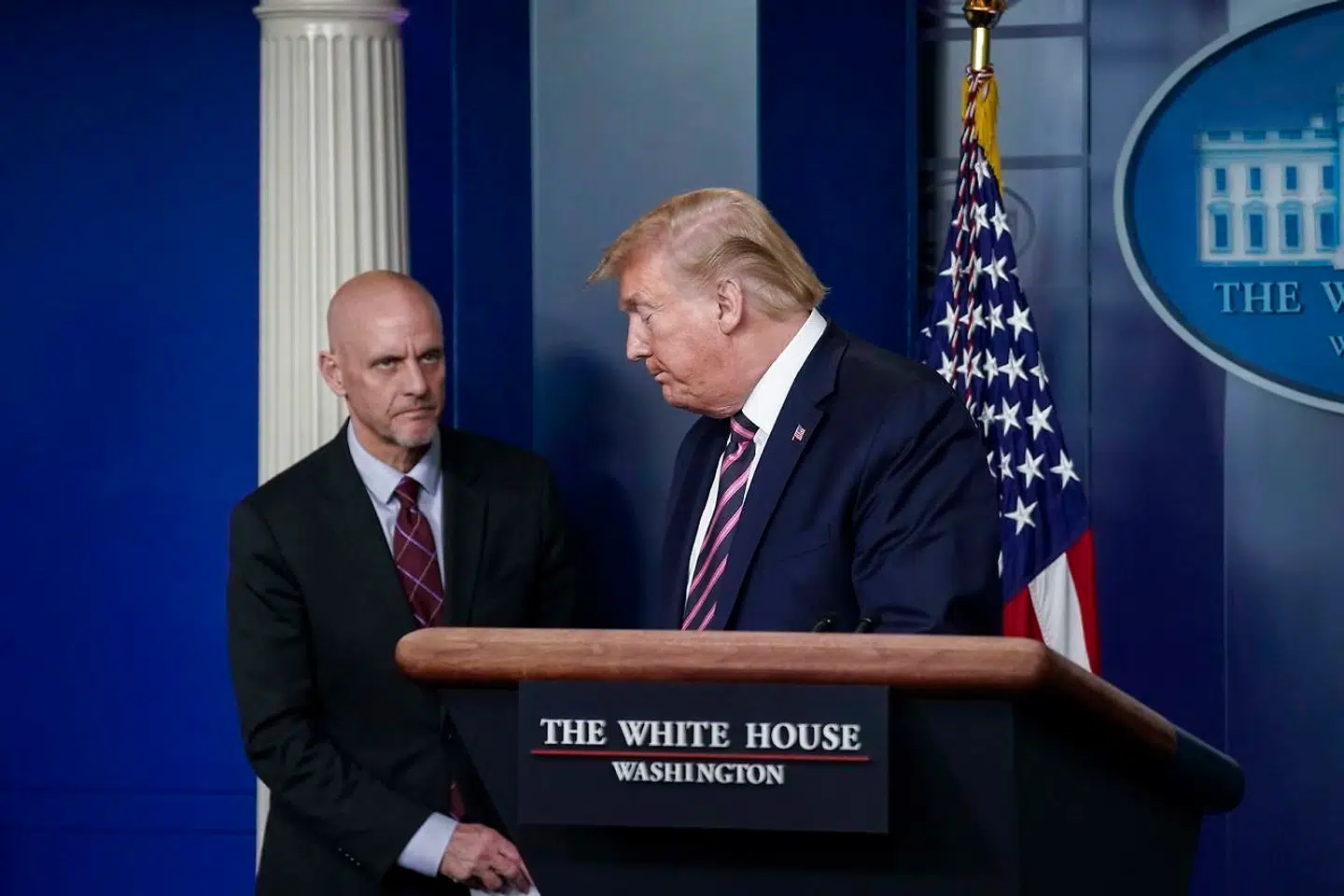 WASHINGTON, DC - APRIL 24: (L-R) FDA Director Stephen Hahn looks on as U.S. President Donald Trump leaves the lectern during the daily coronavirus task force briefing at the White House on April 24, 2020 in Washington, DC. Earlier on Friday, President Trump signed into law the Paycheck Protection Program And Health Care Enhancement Act, a $484 billion bill that aids small businesses and hospitals under stress from the coronavirus pandemic. Drew Angerer/Getty Images/AFP == FOR NEWSPAPERS, INTERNET, TELCOS & TELEVISION USE ONLY ==