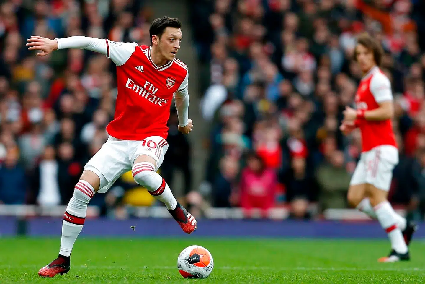Arsenal's German midfielder Mesut Ozil controls the ball during the English Premier League football match between Arsenal and West Ham at the Emirates Stadium in London on March 7, 2020. (Photo by Ian KINGTON / AFP) / RESTRICTED TO EDITORIAL USE.No use with unauthorized audio, video, data, fixture lists, club/league logos or 'live' services. Online in-match use limited to 120 images. An additional 40 images may be used in extra time.No video emulation. Social media in-match use limited to 120 images. An additional 40 images may be used in extra time.No use in betting publications, games or single club/league/player publications. /