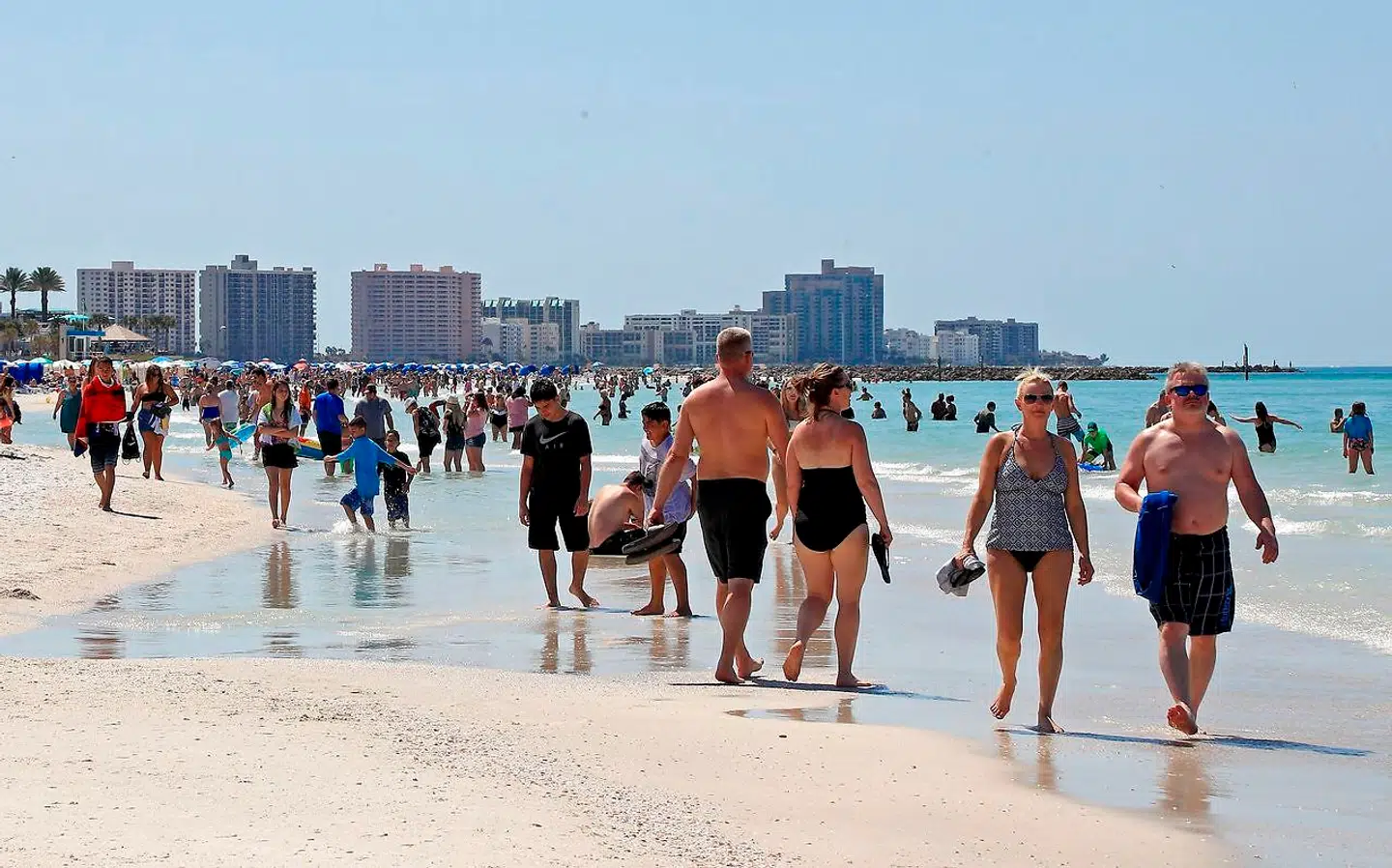 CLEARWATER, FL - MARCH 18: People gather on Clearwater Beach during spring break despite world health officials' warnings to avoid large groups on March 18, 2020 in Clearwater, Florida. The World Health Organization declared COVID-19 a global pandemic on March 11. Mike Ehrmann/Getty Images/AFP == FOR NEWSPAPERS, INTERNET, TELCOS & TELEVISION USE ONLY ==