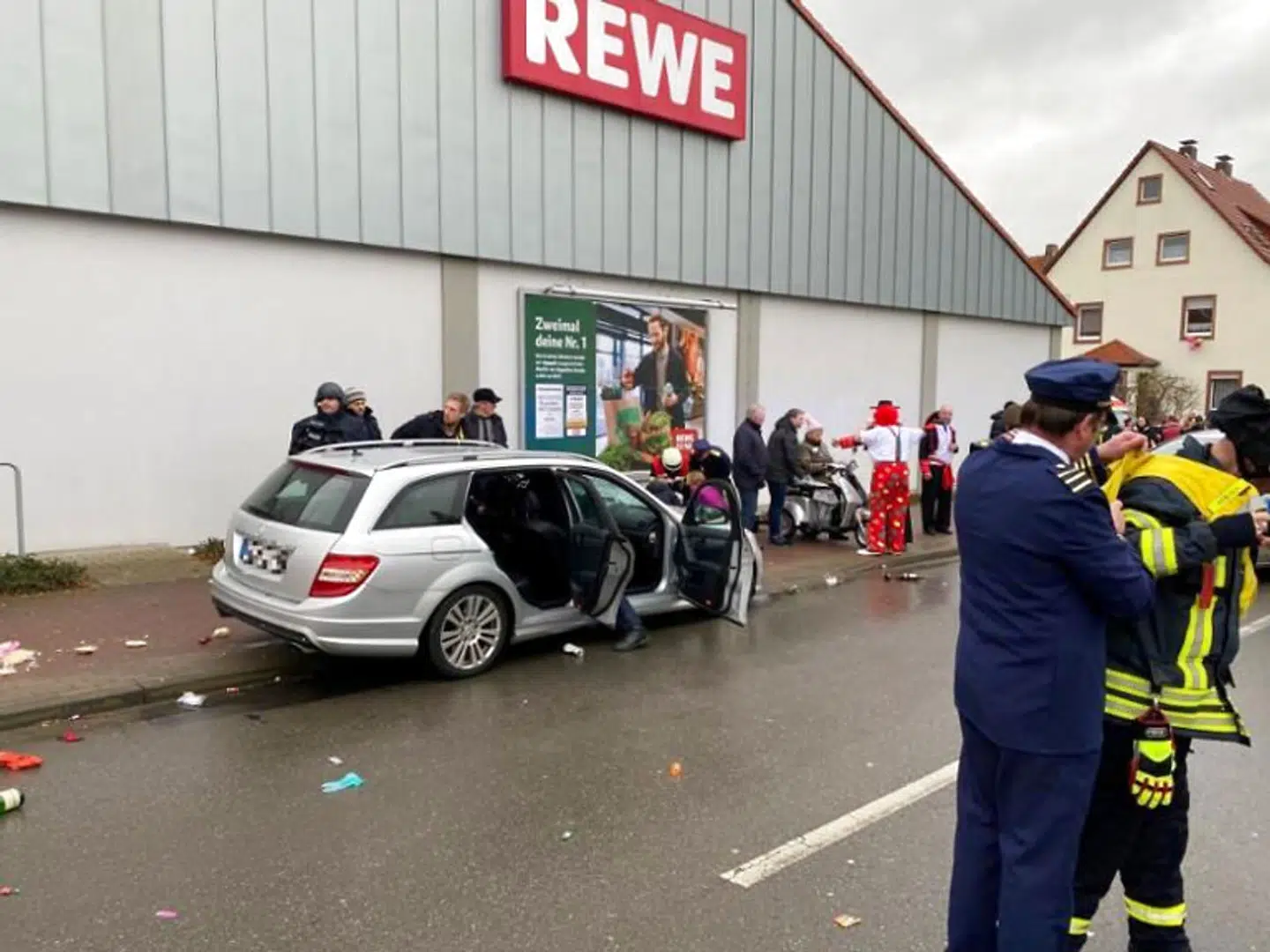 People react at the scene after a car ploughed into a carnival parade injuring several people in Volkmarsen, Germany February 24, 2020. ATTENTION:NUMBER PLATE WAS PIXELATED FROM SOURCE. Elmar Schulten/Waldeckische Landeszeitung via REUTERS.NO RESALES.NO ARCHIVES