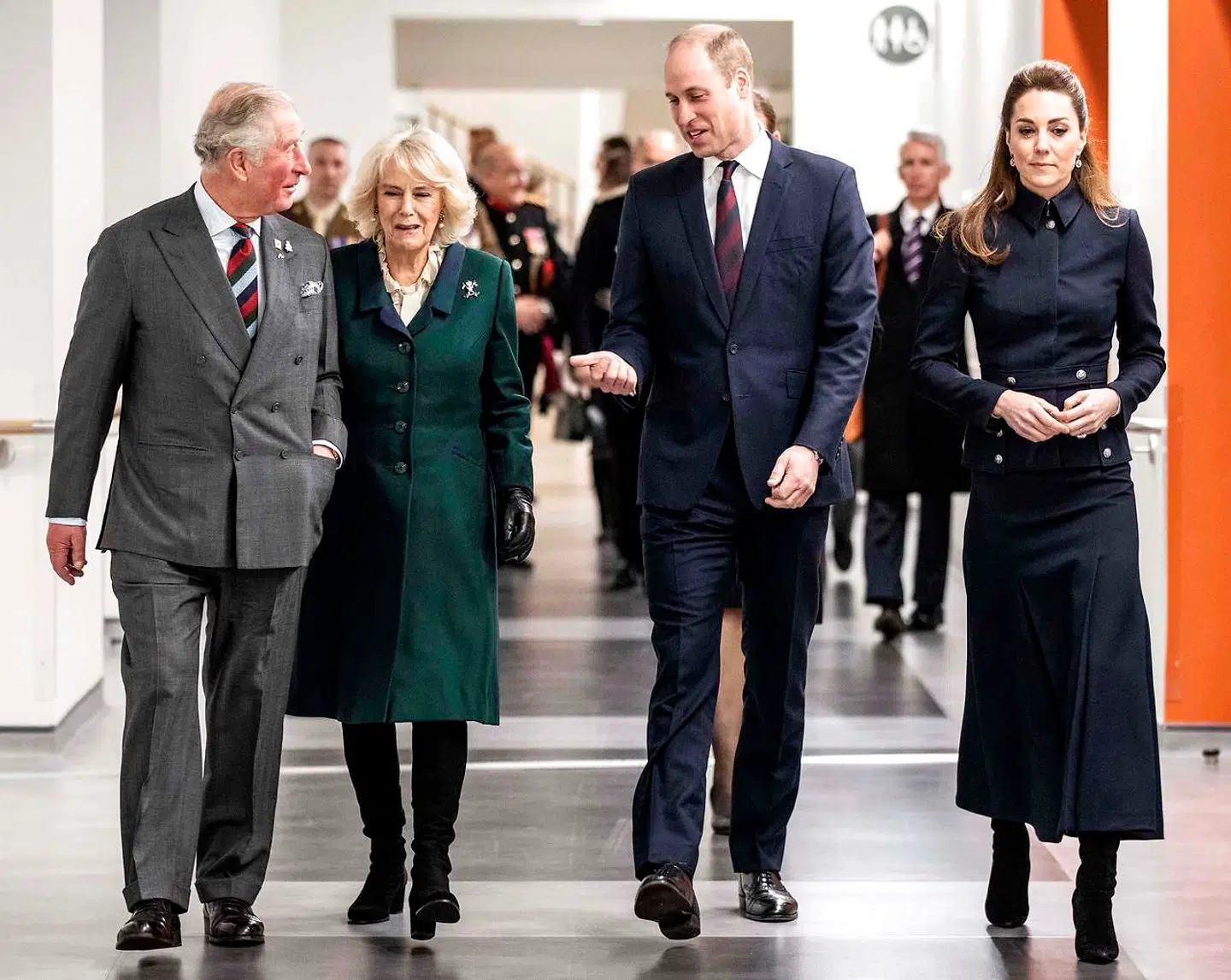 Britain's Prince William, Duke of Cambridge (2R) and his wife Britain's Catherine, Duchess of Cambridge (R) talk with his father Britain's Prince Charles, Prince of Wales (L) and his wife Britain's Camilla, Duchess of Cornwall (2L) during their visit to the Defence Medical Rehabilitation Centre (DMRC) in Loughborough, central England on February 11, 2020. - The DMRC currently provides services to a small group of veterans in the form of the Complex Prosthetic Assessment Clinic (CPAC), which is a joint MOD and NHS England commissioned outpatient clinic. (Photo by Richard Pohle / POOL / AFP)