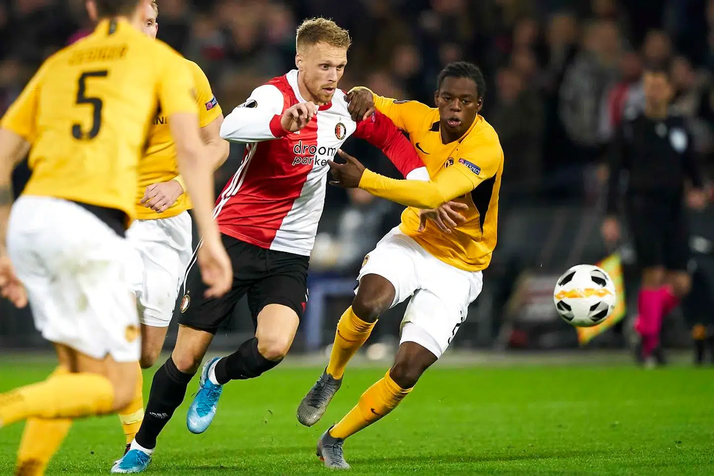 Feyenoord's Dutch forward Nicolai Jorgensen (C) is challenged by BSC Young Boys' Swiss defender Jordan Lotomba during the UEFA Europa League group G soccer match between Feyenoord Rotterdam and BSC Young Boys in Rotterdam, The Netherlands, on November 7, 2019. (Photo by Tom BODE / ANP / AFP) / Netherlands OUT