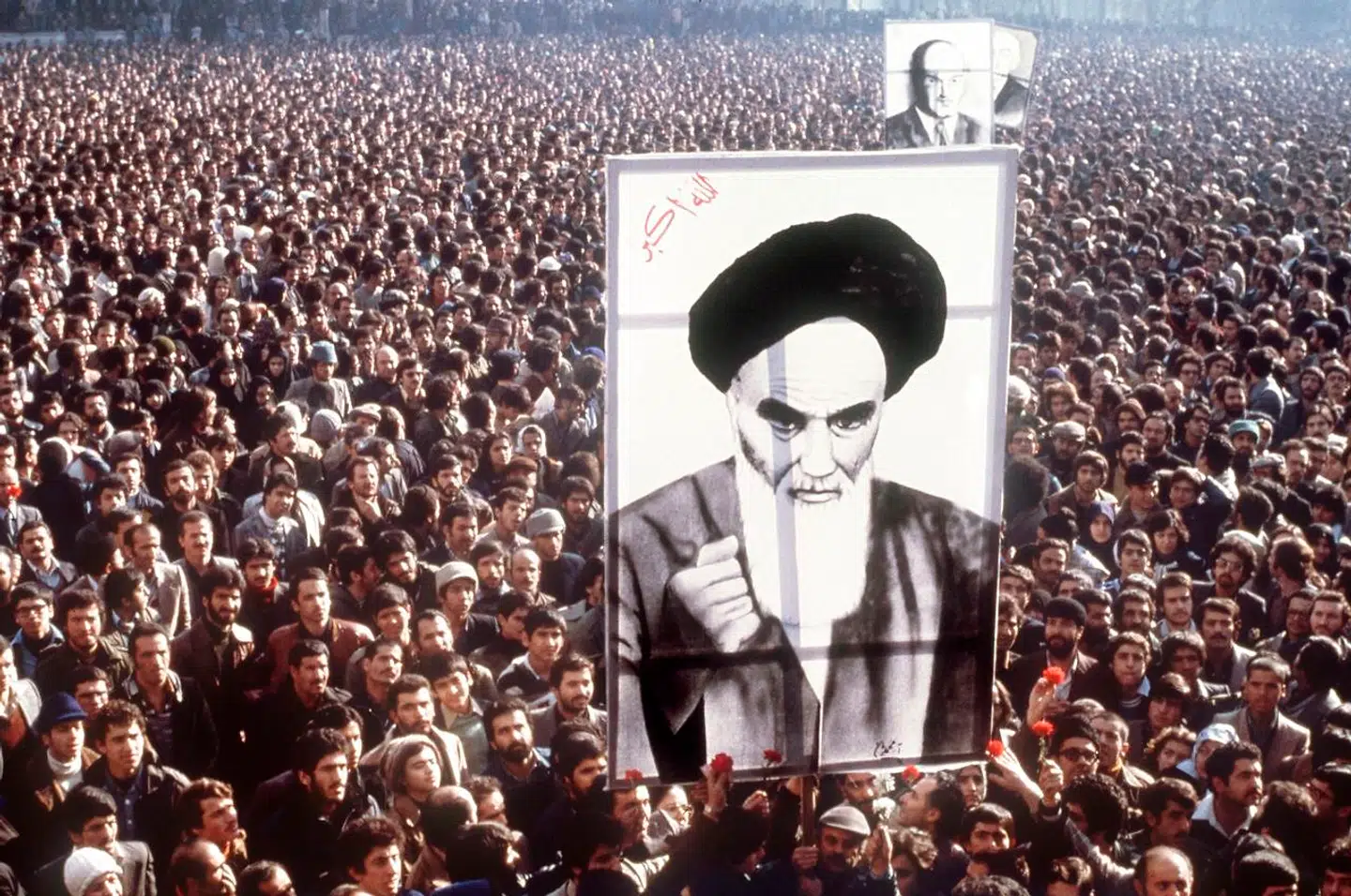 (FILES) In this file photo taken on January 01, 1979, Iranian demonstrators hold a poster of Ayatollah Ruhollah Khomeini in January 1979, during a demonstration in Teheran against the Shah. - On January 16, 1979, Iran's pro-Western Shah Mohammad Reza Pahlavi went into exile, ending 2, 500 years of monarchy. It was the end of a nearly four-decade reign and a pivotal moment in the revolution that installed an Islamic republic and rocked the Middle East. After stays in several countries, the shah ended up in Cairo, where he died on July 27, 1980. (Photo by - / AFP)
