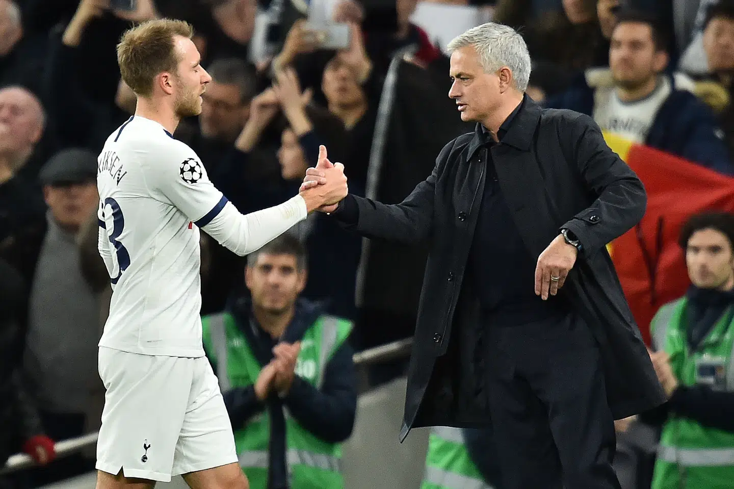 Tottenham Hotspur's Portuguese head coach Jose Mourinho (R) congratulates Tottenham Hotspur's Danish midfielder Christian Eriksen after the UEFA Champions League Group B football match between Tottenham Hotspur and Olympiakos at the Tottenham Hotspur Stadium in north London, on November 26, 2019. - Tottenham won the match 4-2. (Photo by Glyn KIRK / IKIMAGES / AFP)