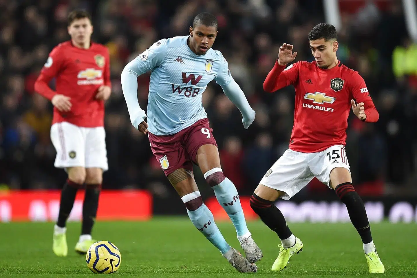 Aston Villa's Brazilian striker Wesley (C) vies with Manchester United's Belgian-born Brazilian midfielder Andreas Pereira (R) during the English Premier League football match between Manchester United and Aston Villa at Old Trafford in Manchester, north west England, on December 1, 2019. (Photo by Oli SCARFF / AFP) / RESTRICTED TO EDITORIAL USE.No use with unauthorized audio, video, data, fixture lists, club/league logos or 'live' services. Online in-match use limited to 120 images. An additional 40 images may be used in extra time.No video emulation. Social media in-match use limited to 120 images. An additional 40 images may be used in extra time.No use in betting publications, games or single club/league/player publications. /