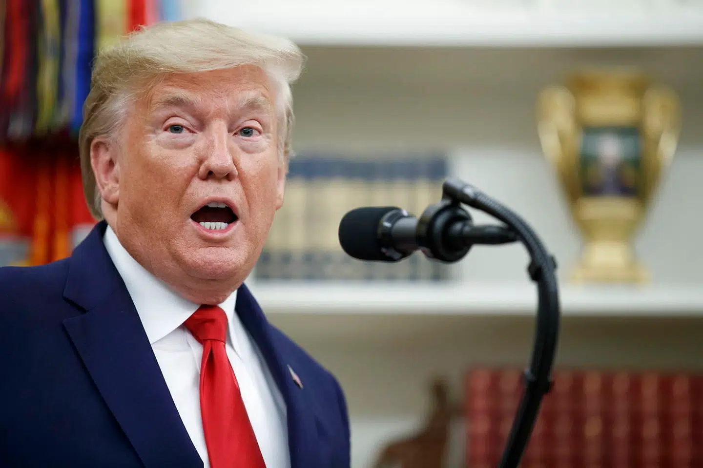epa07947773 US President Donald J. Trump delivers remarks during a Presidential Medal of Freedom ceremony for American racing magnate Roger Penske in the Oval Office of the White House in Washington, DC, USA, 24 October 2019. The Medal of Freedom is awarded by the president to citizens who make an 'especially meritorious contribution to the security or national interests of the United States, or world peace, or cultural or other significant public or private endeavors.' EPA/SHAWN THEW