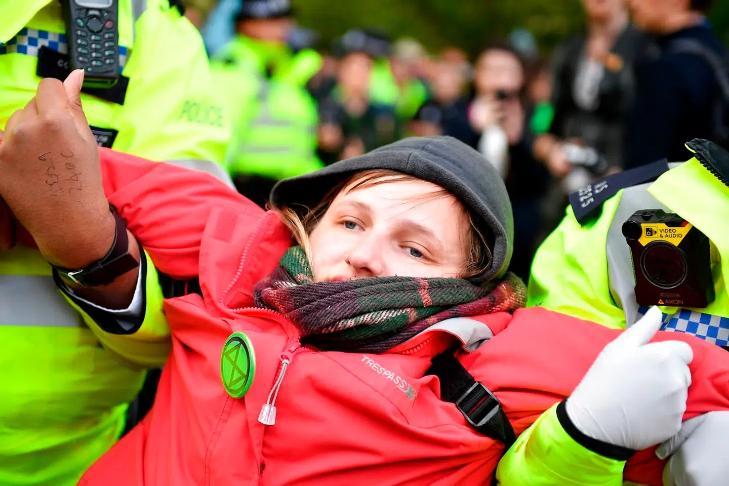 Police arrest a climate activist near Downing Street during the third day of climate change demonstrations by the Extinction Rebellion group, in central London on October 9, 2019. - Demonstrations occurred in 60 cities around the world this week, with thousands taking to the streets of New Delhi, Cape Town, Paris, Vienna, Madrid, and Buenos Aires. Extinction Rebellion is demanding that governments drastically cut carbon emissions. (Photo by DANIEL LEAL-OLIVAS / AFP)