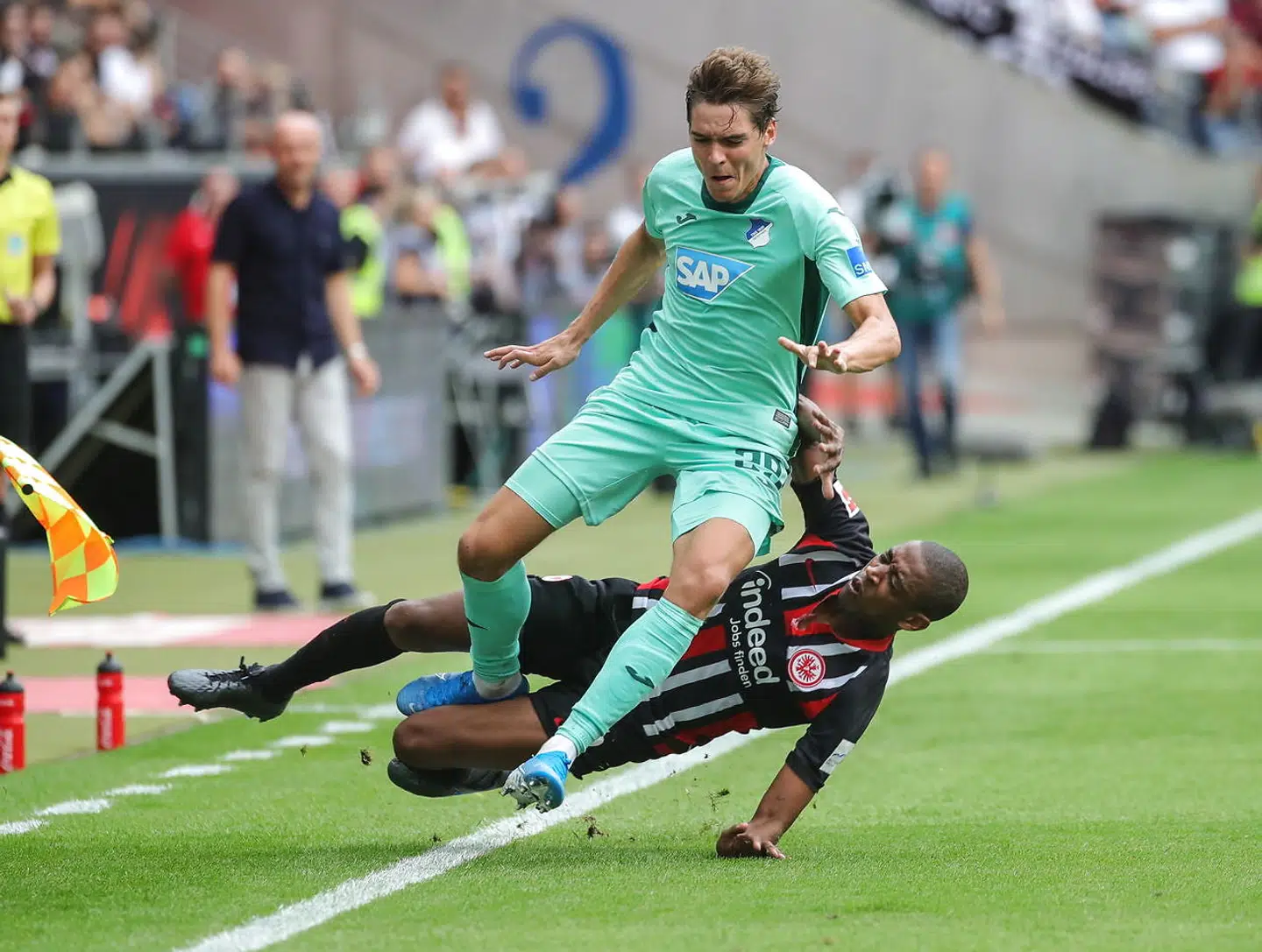 epa07779398 Frankfurt's Gelson Fernandes (down) in action against Hoffenheim's Robert Skov during the German Bundesliga soccer match between Eintracht Frankfurt and TSG Hoffenheim in Frankfurt Main, Germany, 18 August 2019. EPA/ARMANDO BABANI CONDITIONS - ATTENTION: The DFL regulations prohibit any use of photographs as image sequences and/or quasi-video