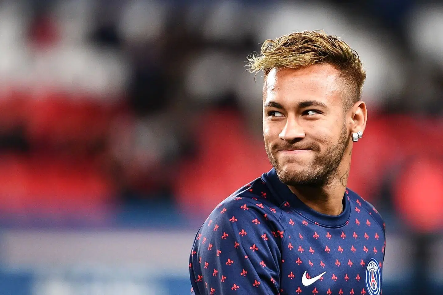 (FILES) In this file photo taken on October 07, 2018 Paris Saint-Germain's Brazilian forward Neymar smiles during warm up prior to the French L1 football match between Paris Saint-Germain (PSG) and Olympique de Lyon (OL) at the Parc des Princes stadium in Paris. A Brazilian judge on August 9, 2019 dismissed the rape case against footballer Neymar citing insufficient evidence, court sources told AFP. - The decision - - the final episode in the rape case against the Brazilian international superstar - - comes on the recommendations of prosecutors just over a month after police dropped the case citing lack of evidence. (Photo by FRANCK FIFE / AFP)