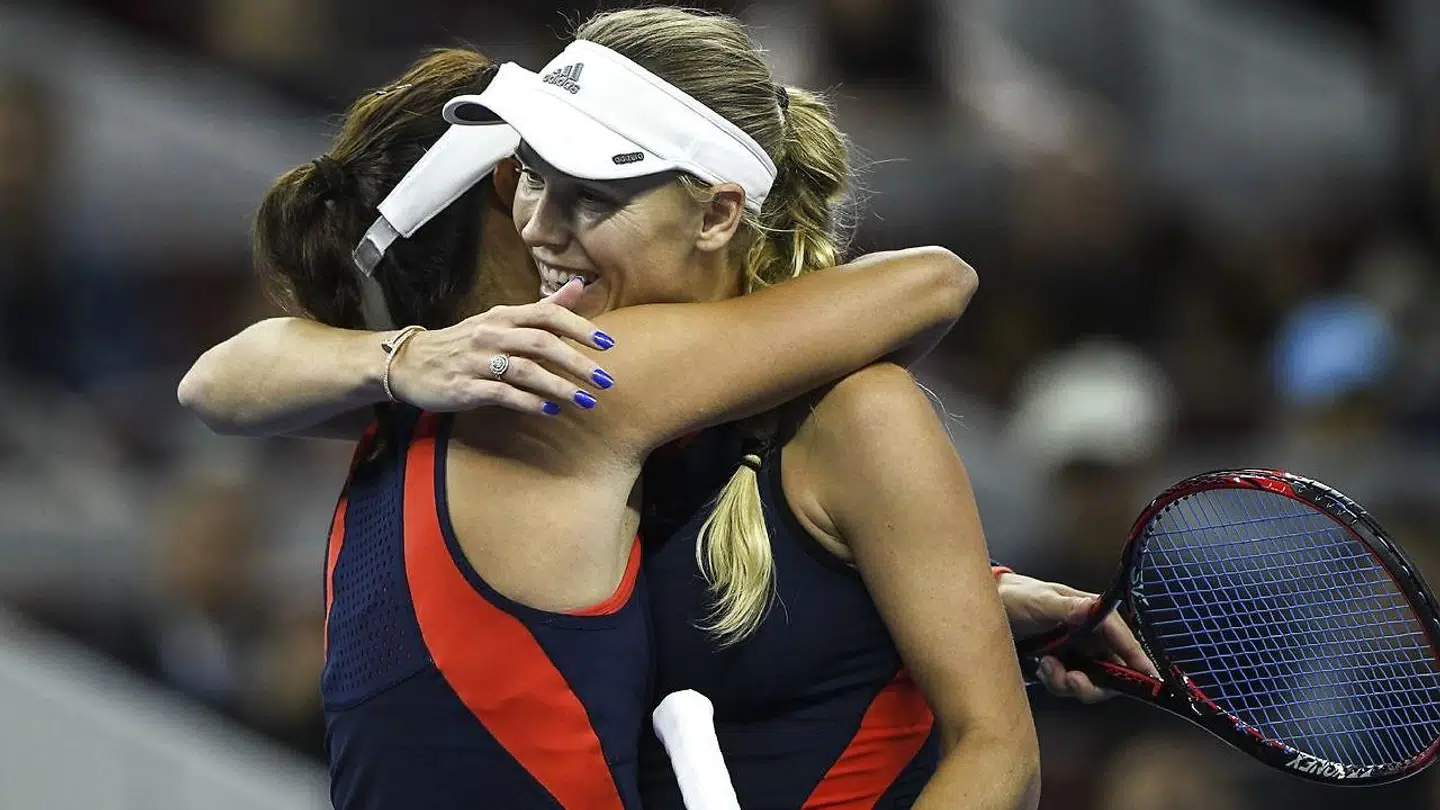 Wang Qiang, der her taber til Caroline Wozniacki, er blevet trænet af Peter McNamara.