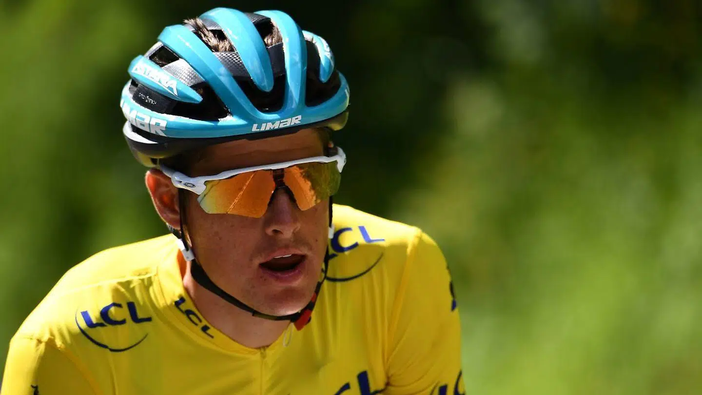 TOPSHOT - Astana Pro Team rider Denmark's Jakob Fuglsang, wearing the overall leader's yellow jersey, rides during the eighth and last stage of the 71st edition of the Criterium du Dauphine cycling race, 113, 5 km between Cluses and Champery on June 16, 2019. (Photo by Anne-Christine POUJOULAT / AFP)