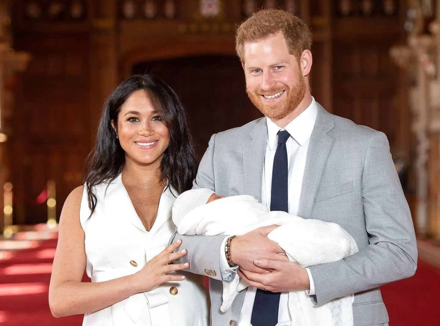 Britain's Prince Harry, Duke of Sussex (R), and his wife Meghan, Duchess of Sussex, pose for a photo with their newborn baby son in St George's Hall at Windsor Castle in Windsor, west of London on May 8, 2019. (Photo by Dominic Lipinski / POOL / AFP)