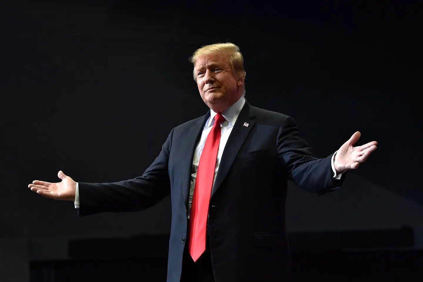TOPSHOT - US President Donald Trump arrives for a campaign rally in Grand Rapids, Michigan on March 28, 2019. (Photo by Nicholas Kamm / AFP)