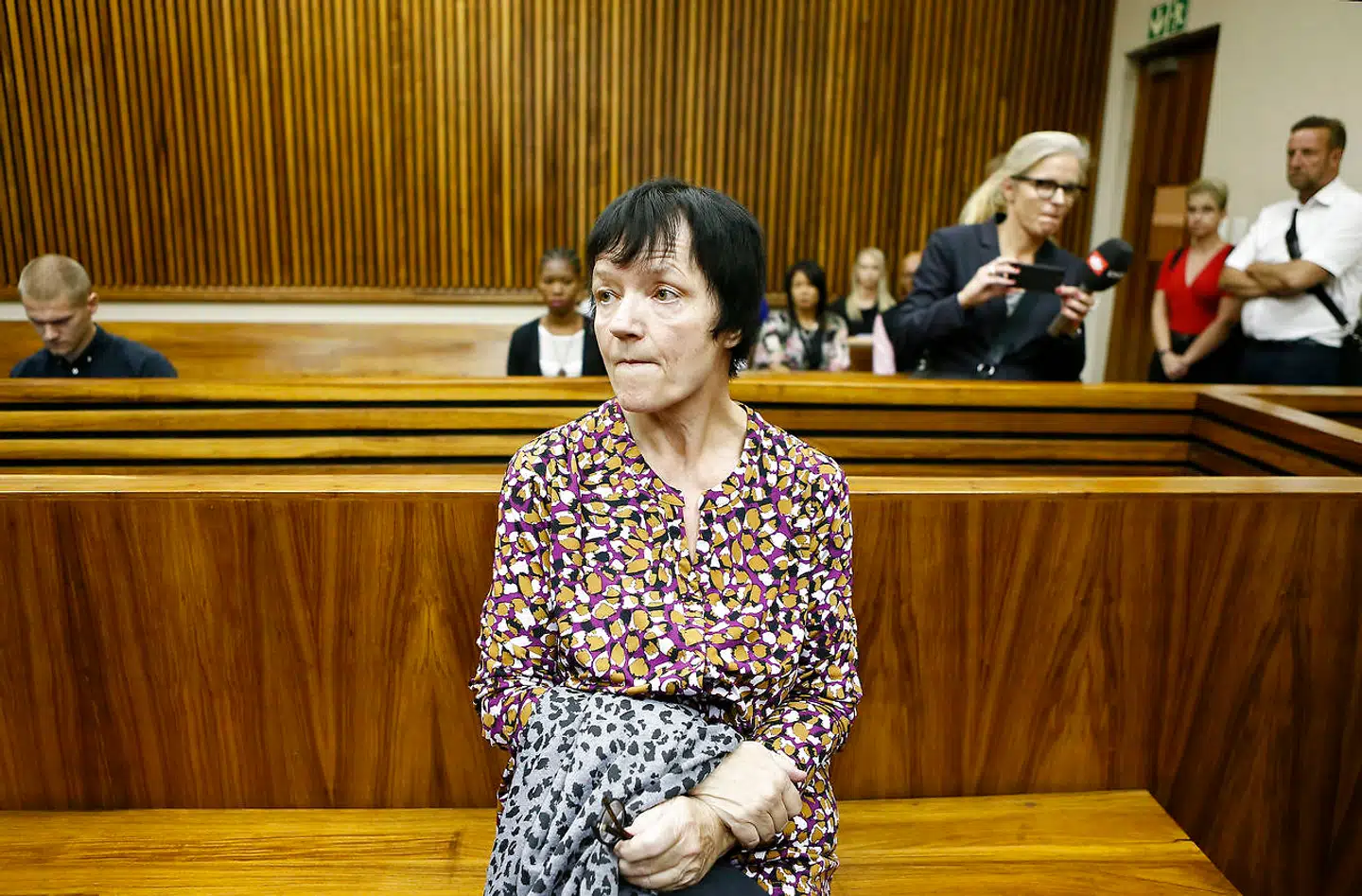 Anna Britta Troelsgaard Nielsen leaves the court room at the Randburg Magistrate Court on November 8, 2018 in Johannesburg, South Africa. Anna Britta Troelsgaard Nielsen is accused of embezzlement to an extent of around 111 million danish kroner. (Photo by Phill Magakoe / AFP)