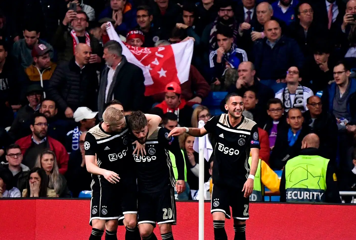Ajax players celebrate after Ajax's Danish midfielder Lasse Schone scored during the UEFA Champions League round of 16 second leg football match between Real Madrid CF and Ajax at the Santiago Bernabeu stadium in Madrid on March 5, 2019. (Photo by JAVIER SORIANO / AFP)