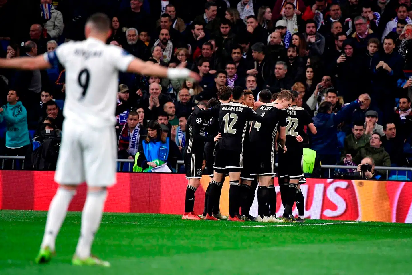 Ajax's players celebrate after Ajax's Serbian forward Dusan Tadic scored a goal during the UEFA Champions League round of 16 second leg football match between Real Madrid CF and Ajax at the Santiago Bernabeu stadium in Madrid on March 5, 2019. (Photo by JAVIER SORIANO / AFP)
