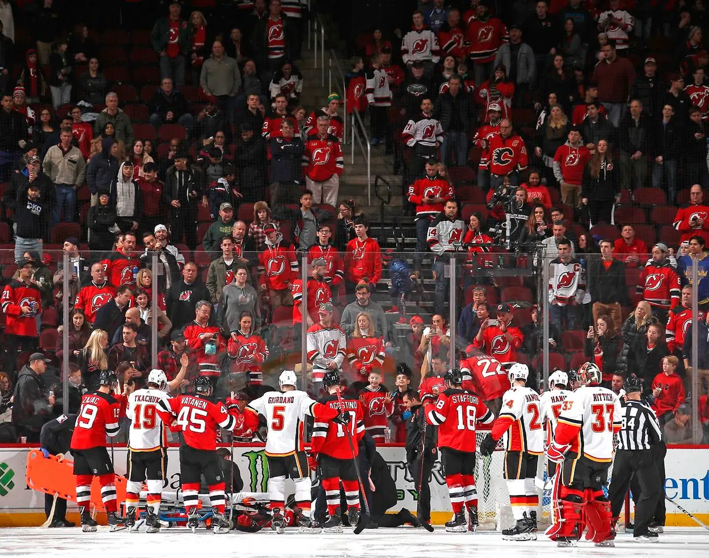 NEWARK, NEW JERSEY - FEBRUARY 27: Mirco Mueller #25 of the New Jersey Devils is injured during the third period injury against the Calgary Flames at the Prudential Center on February 27, 2019 in Newark, New Jersey. The Flames defeated the devils 2-1. Bruce Bennett/Getty Images/AFP == FOR NEWSPAPERS, INTERNET, TELCOS & TELEVISION USE ONLY ==