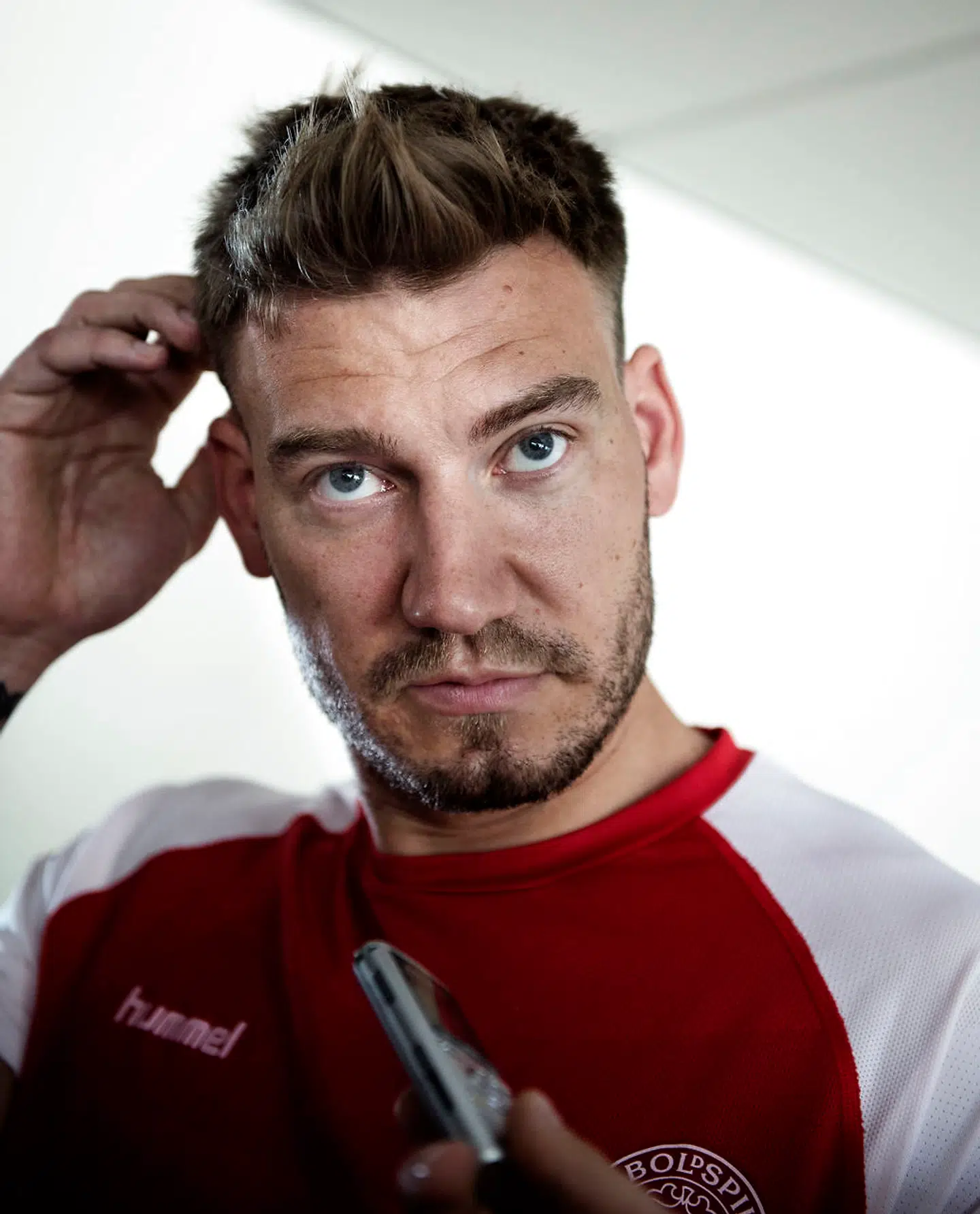 (ARKIV) Nicklas Bendtner under landsholdets pressemøde på Hotel Marienlyst i Helsingør onsdag den 30 maj 2018. Fodboldspilleren Nicklas Bendtner er ifølge Ekstra Bladet blevet sigtet for vold efter en episode med en taxachauffør natten til søndag. Det skriver Ritzau, søndag den 9. september 2018.. (Foto: Liselotte Sabroe/Ritzau Scanpix)