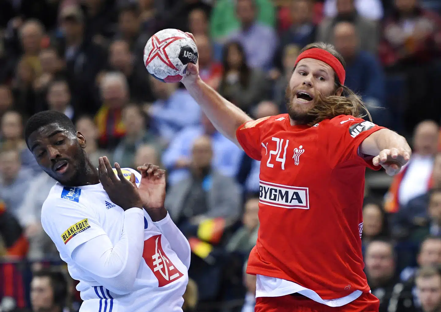IHF Handball World Championship - Germany & Denmark 2019 - Semi Final - Denmark v France - Barclaycard Arena, Hamburg, Germany - January 25, 2019 Denmark's Mikkel Hansen in action with France's Dika Mem during the match REUTERS/Annegret Hilse
