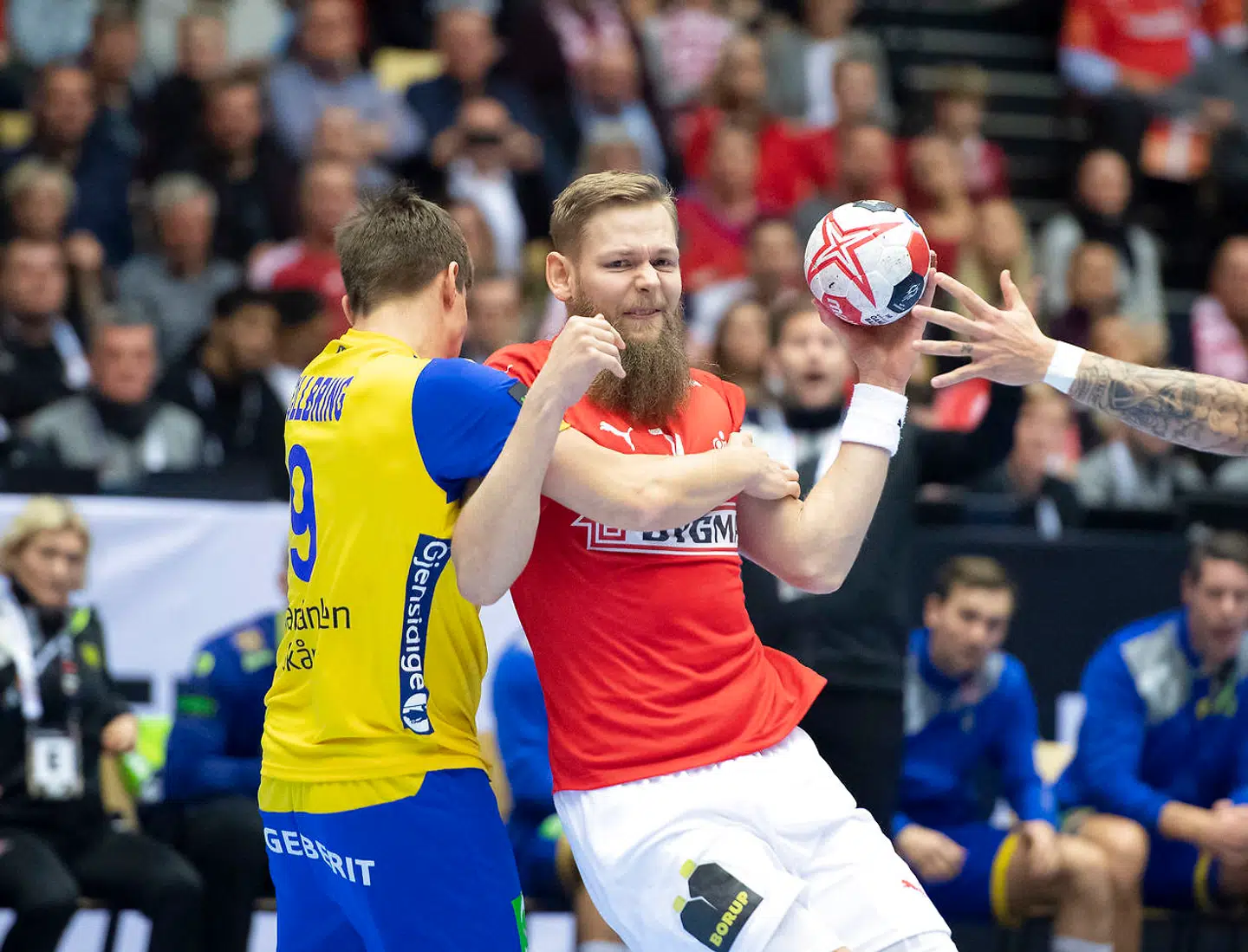 Nikolaj Øris Nielsen of Denmark and Jerry Tollbring of Sweden during the men's IHF Handball World Championship Main Round Group 2 match between Denmark and Sweden in Herning, Denmark, Wednesday, Jan. 23, 2019.