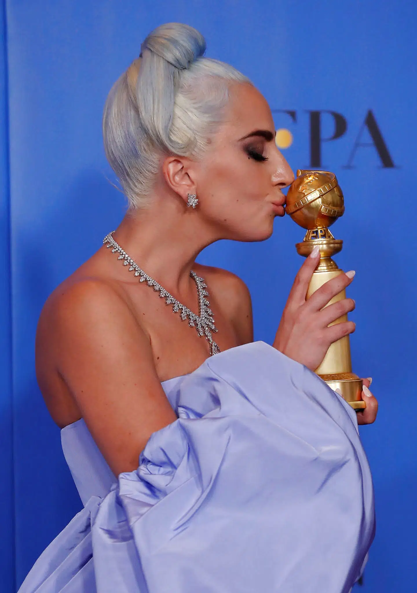 76th Golden Globe Awards - Photo Room - Beverly Hills, California, U.S., January 6, 2019 Lady Gaga poses backstage with her Best Original Song - Motion Picture award for "Shallow"? from "A Star is Born" REUTERS/Mario Anzuoni