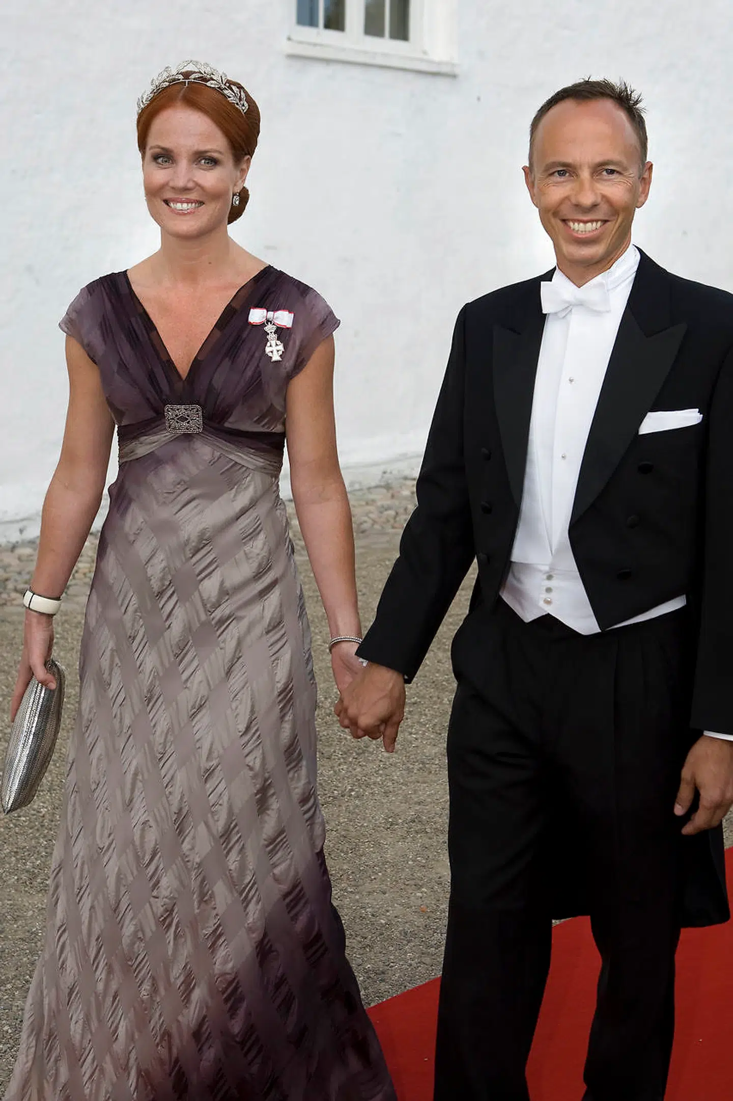 Caroline og Peter Heering fotograferet ved prins Joachim og prinsesse Maries bryllup. Caroline Heering har været hofdame for kronprinsessen og Peter Heering er nær ven af kronprinsen. (Arkivfoto)