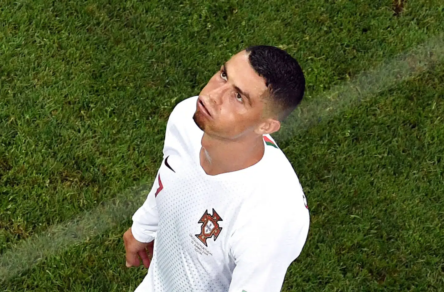 (FILES) In this file photo taken on June 30, 2018 Portugal's forward Cristiano Ronaldo reacts during the Russia 2018 World Cup round of 16 football match between Uruguay and Portugal at the Fisht Stadium in Sochi on June 30, 2018. - Cristiano Ronaldo has been left out of Portugal's next four internationals, the national coach Fernando Santos said on October 4, 2018, days after rape allegations against the Real Madrid star resurfaced. (Photo by Kirill KUDRYAVTSEV / AFP) / RESTRICTED TO EDITORIAL USE - NO MOBILE PUSH ALERTS/DOWNLOADS