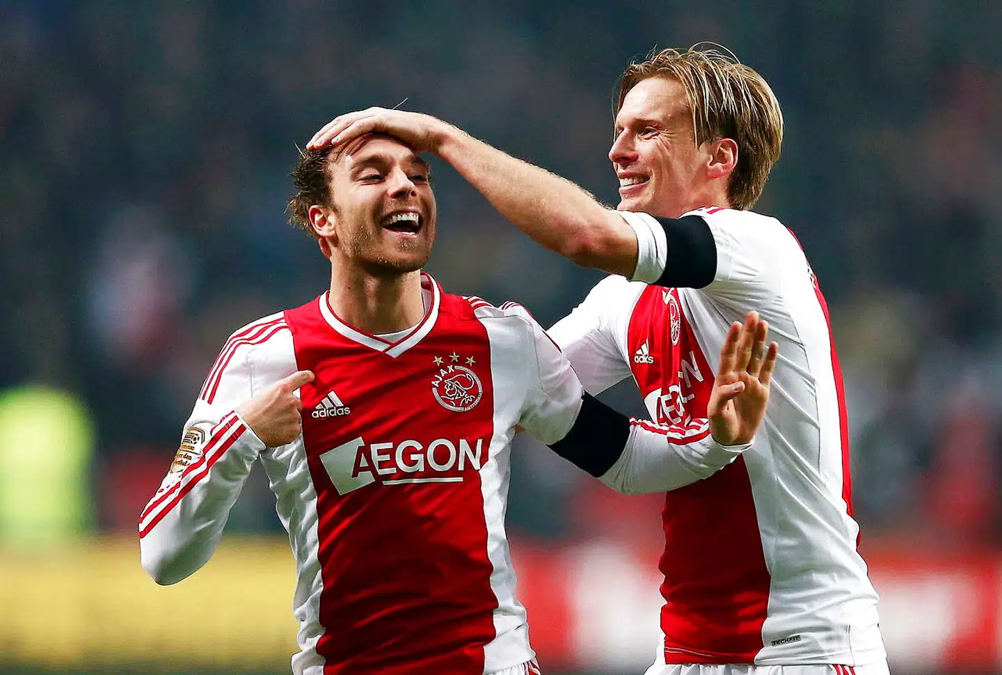 Christian Poulsen sammen med Christian Eriksen i Ajax-trøjen.
